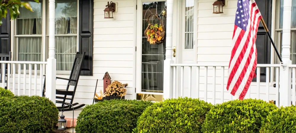 house-with-american-flag-and-lawn